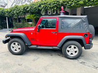Vista lateral Jeep Wrangler Sport 2017 con toldo suave